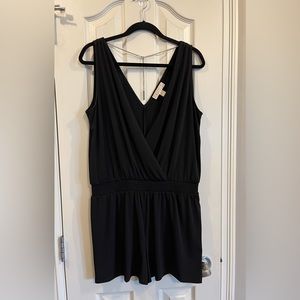 Michael Kors black short romper with chain detail at back. Size large.